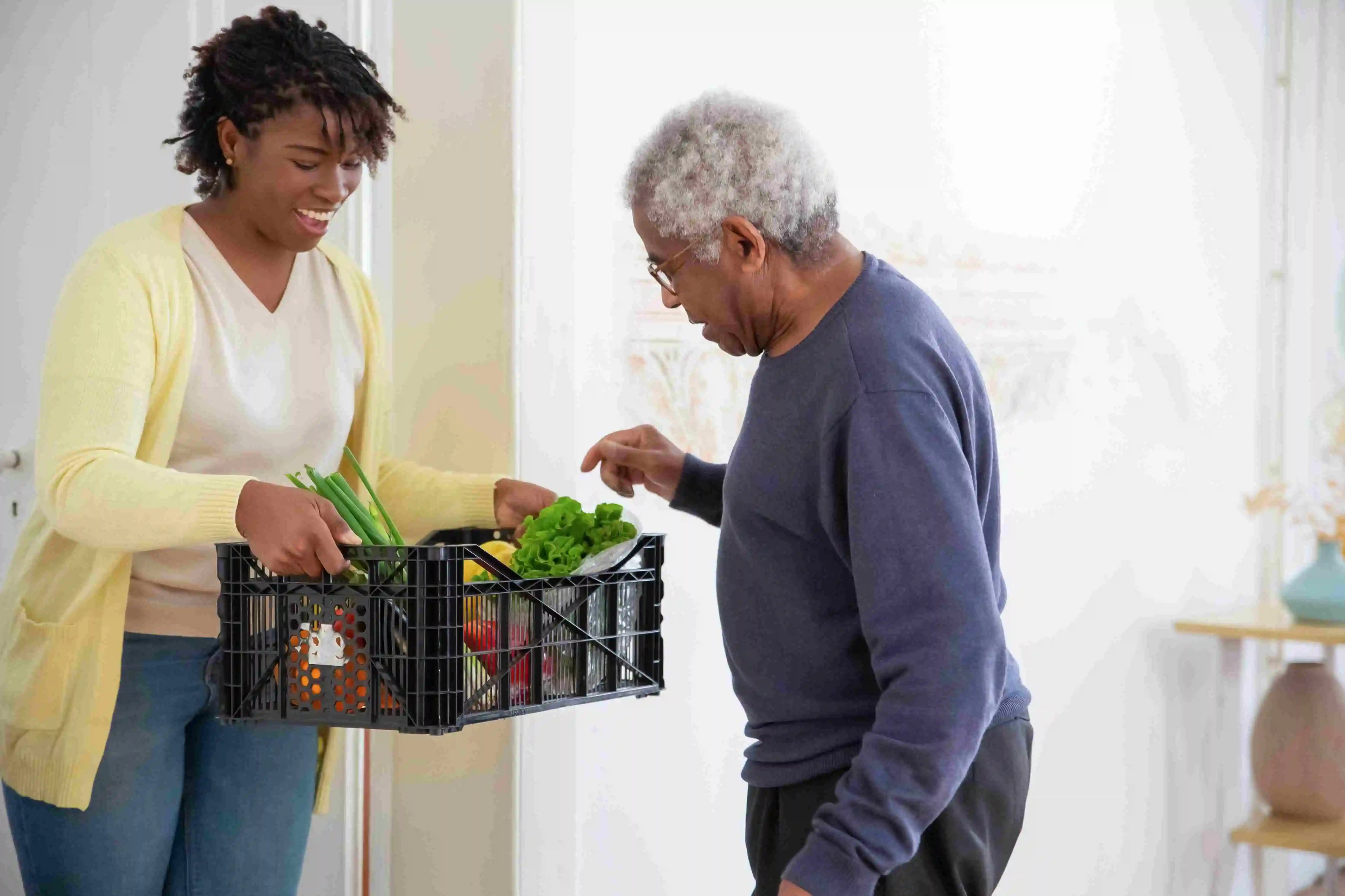 Charities can utilize corporate volunteers for a number of different food relief jobs, such as delivering fresh food boxes to vulnerable seniors. 